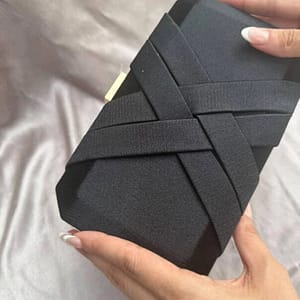 crossed satin clutch in black