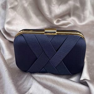 crossed satin clutch in navy blue